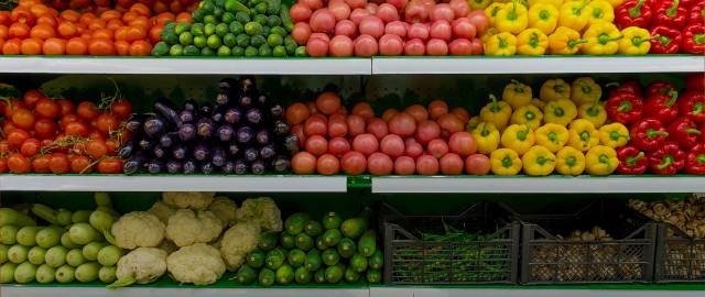 shelves of produce at a grocery store